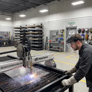 Fabricator operating precision metalworking equipment