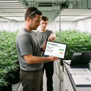 Cultivation team using mobile app in grow room