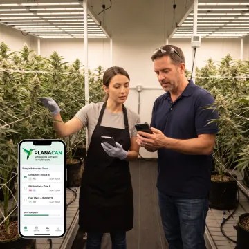 Grow team reviewing cultivation workflow on a mobile app
