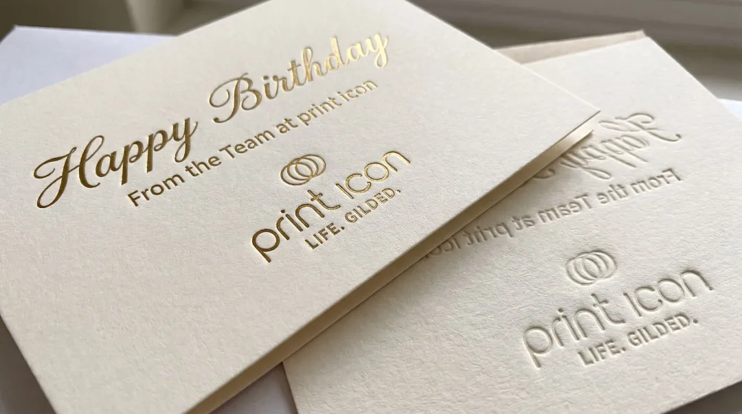 Engraved executive birthday card with metallic ink lettering on ivory stock