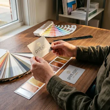 Designer reviewing business card proofs