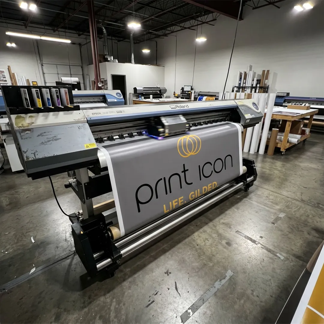 Large format digital printer producing a colorful banner