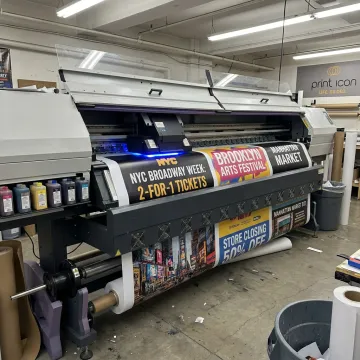 Large format printer producing colorful banners and signs
