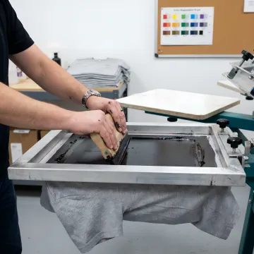 Custom T-shirts being printed for a rush apparel order
