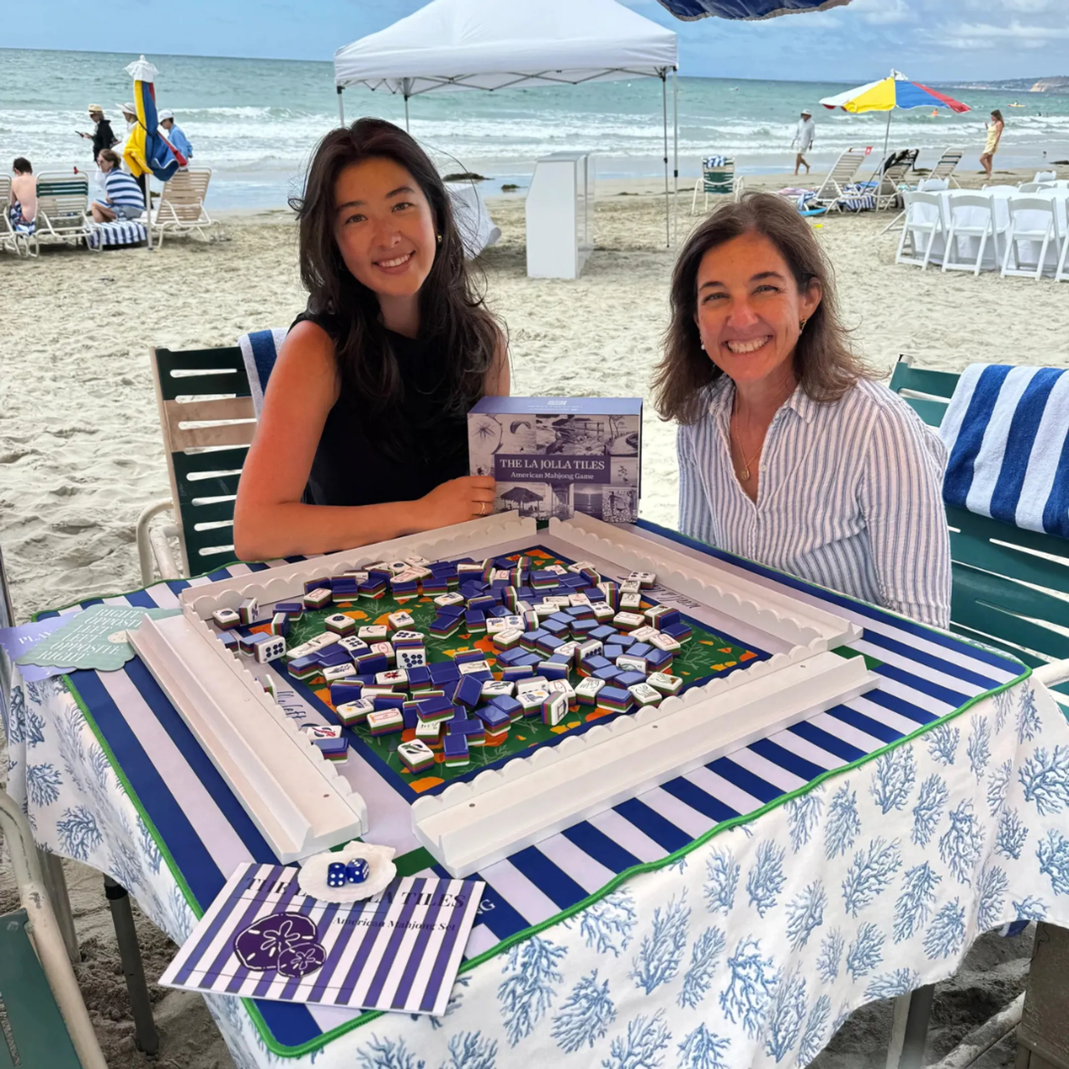 Designer reviewing a custom mahjong tile prototype