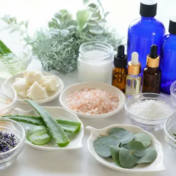 Natural shaving cream ingredients including plant extracts, essential oils, and organic botanicals