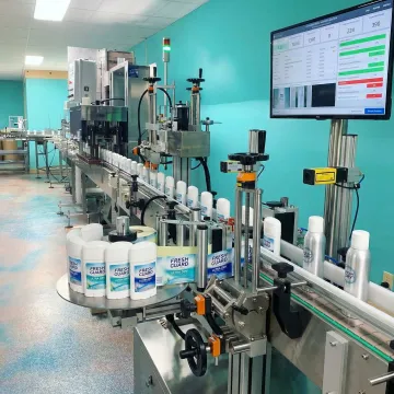 Deodorant products being filled and packaged on manufacturing line