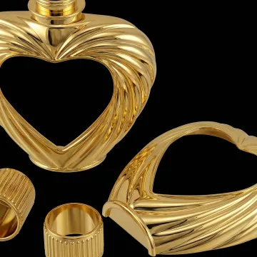 Close-up of gold metallized cosmetic bottle cap with UV coating