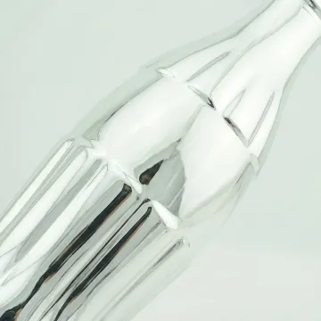 Close-up of precision silver mirror coating on glass bottle surface