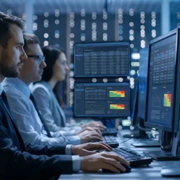 Cybersecurity analysts monitoring insider threat alerts