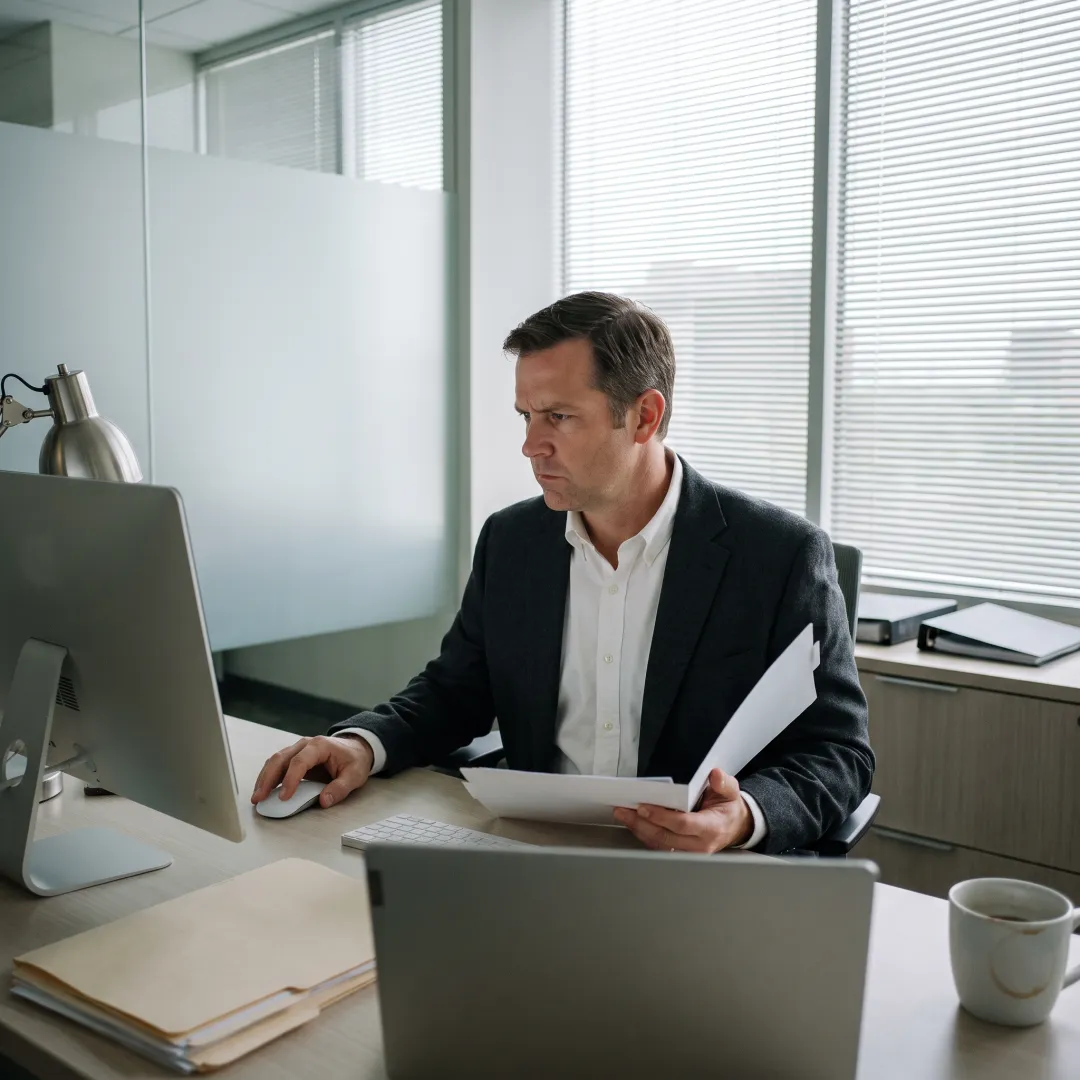 Corporate investigator reviewing digital evidence in Houston