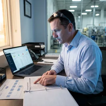 Quality professional reviewing an ISO 9001 audit checklist