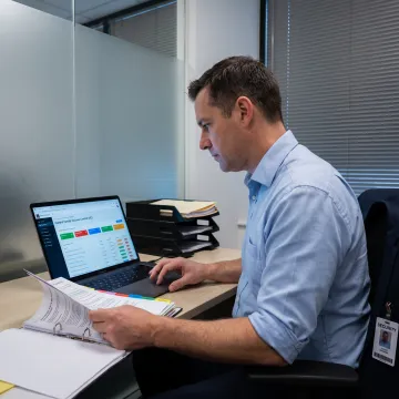 Defense compliance professional reviewing cybersecurity controls