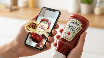 Consumer scanning QR code on product packaging with AR experience appearing on phone screen