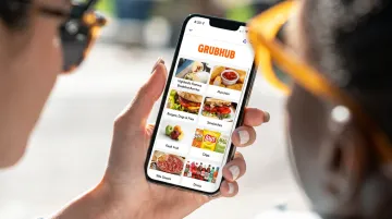 Food truck digital menu displayed on smartphone in bright outdoor sunlight