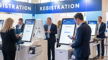 Enterprise event check-in station with multiple iPad scanning terminals and badge printer