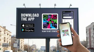 Out-of-home billboard advertisement displaying QR code for mobile app download