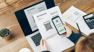 Tenant scanning QR code on rent statement to access online payment portal