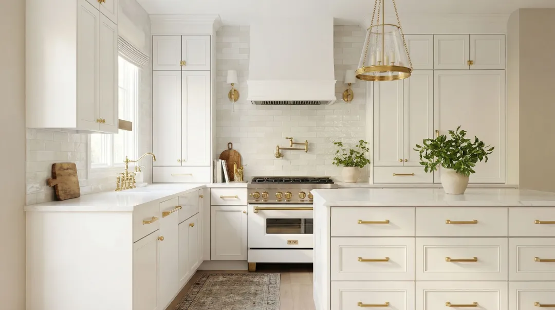 bright white kitchen cabinets with warm greige neutral painted walls and wood flooring