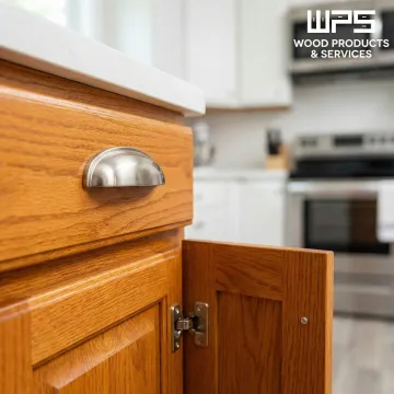 Restored kitchen cabinets with new hardware and refinished surfaces