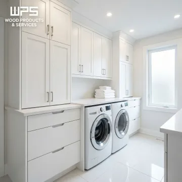 Clean white custom laundry room cabinets with organized storage and appliance integration