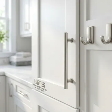 Close-up of brushed nickel cabinet pulls and hooks installed on laundry room cabinetry