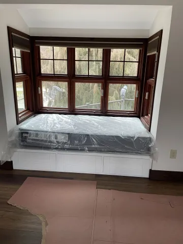 Cabinet installation process showing precise fitting and finishing of custom cabinets