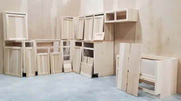 Close-up of custom hardwood cabinet door with smooth finish and soft-close hinge