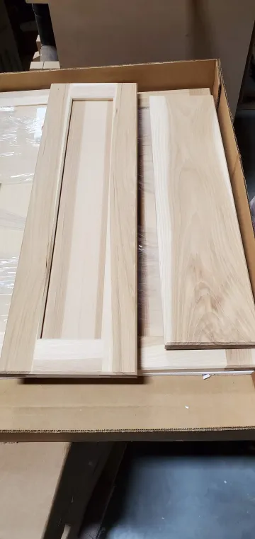 Close-up of modern white oak cabinet door showing natural grain and smooth finish