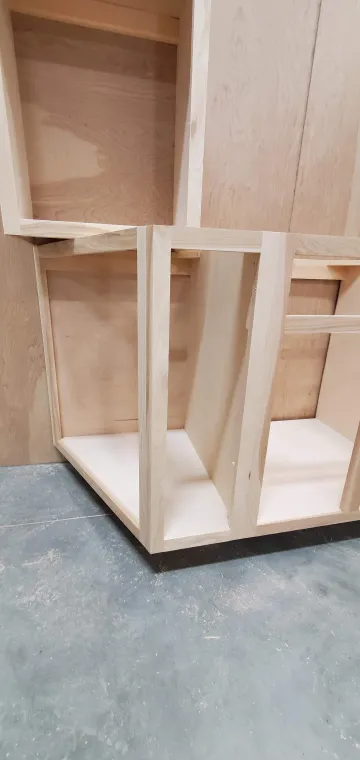 Step-by-step cabinet refinishing process from sanding to final painted finish