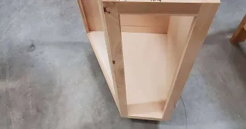 Close-up of solid wood cabinet construction showing hardwood face frame