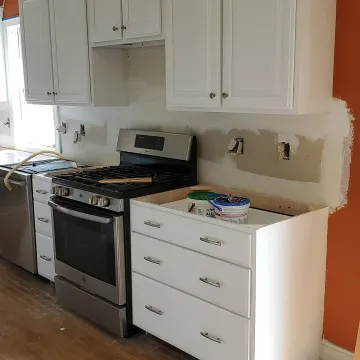 Custom hardwood cabinets installed in a renovated kitchen