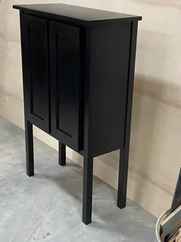 Two-tone kitchen with white upper cabinets black hardware and dark lower cabinets