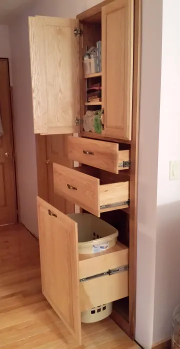 Artisan handcrafting a rustic hardwood bathroom vanity cabinet in a woodworking workshop