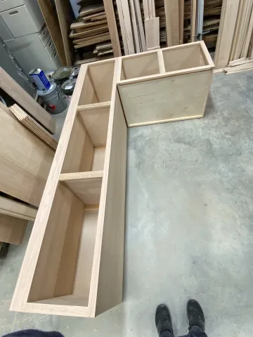 Craftsman building custom bathroom vanity in workshop