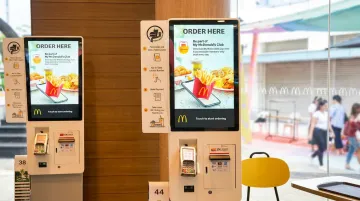 QSR self-order kiosk displaying digital menu in fast food restaurant