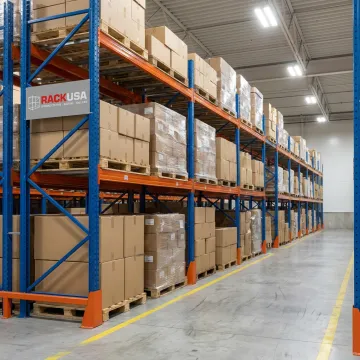 Structural pallet rack beams and upright frames in warehouse