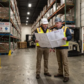 Warehouse team planning a selective rack layout