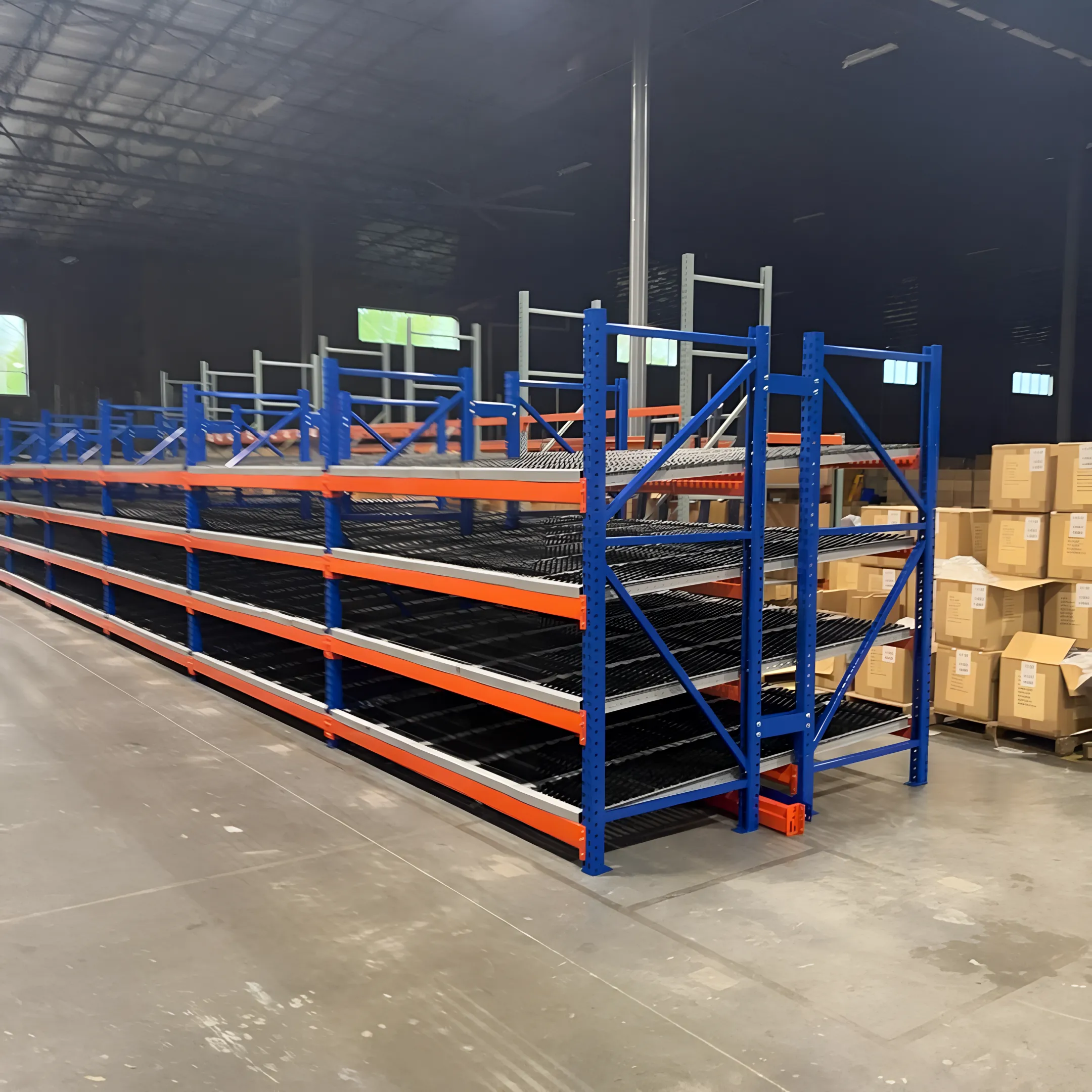 Carton flow rack with roller lanes in warehouse