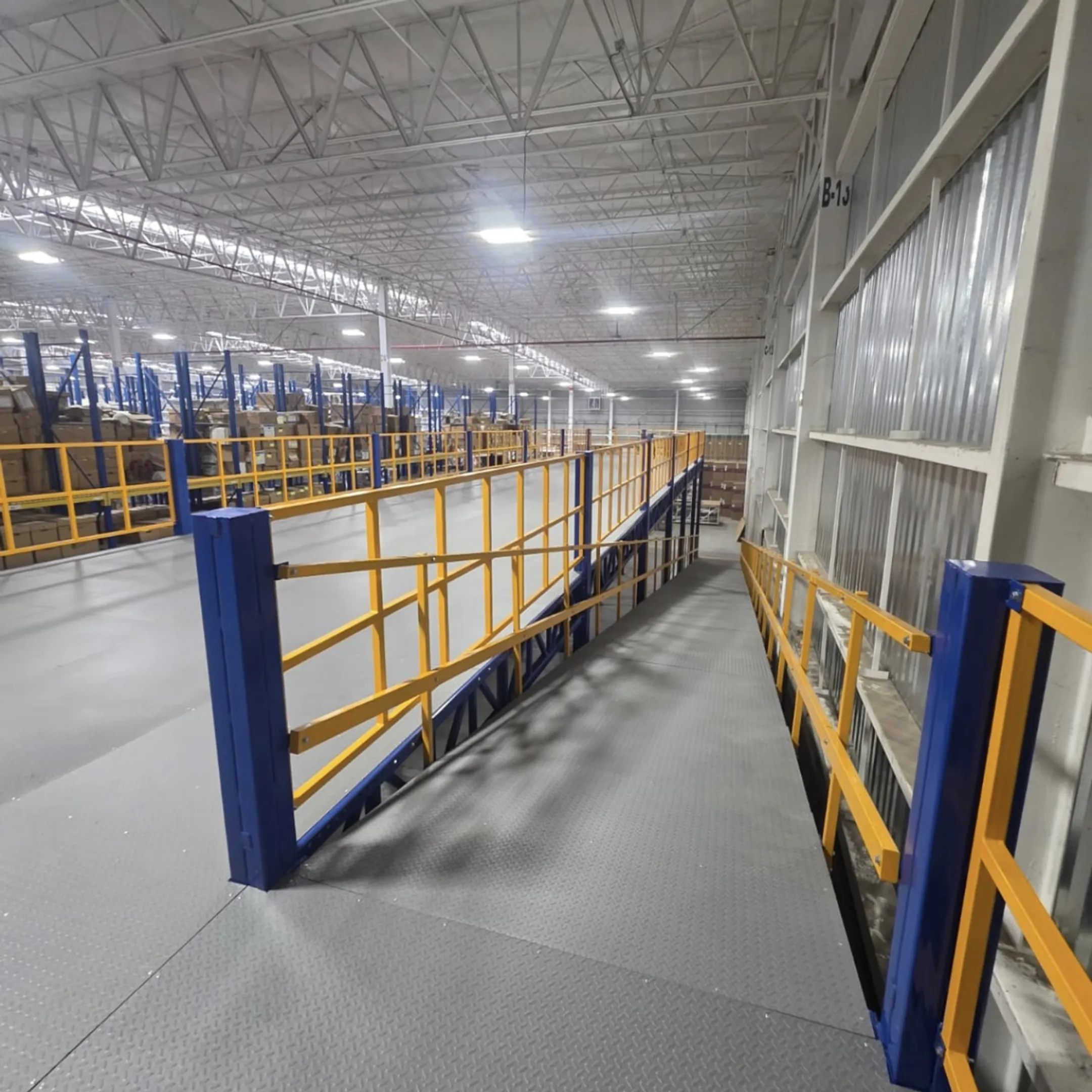 Technicians installing a warehouse mezzanine platform