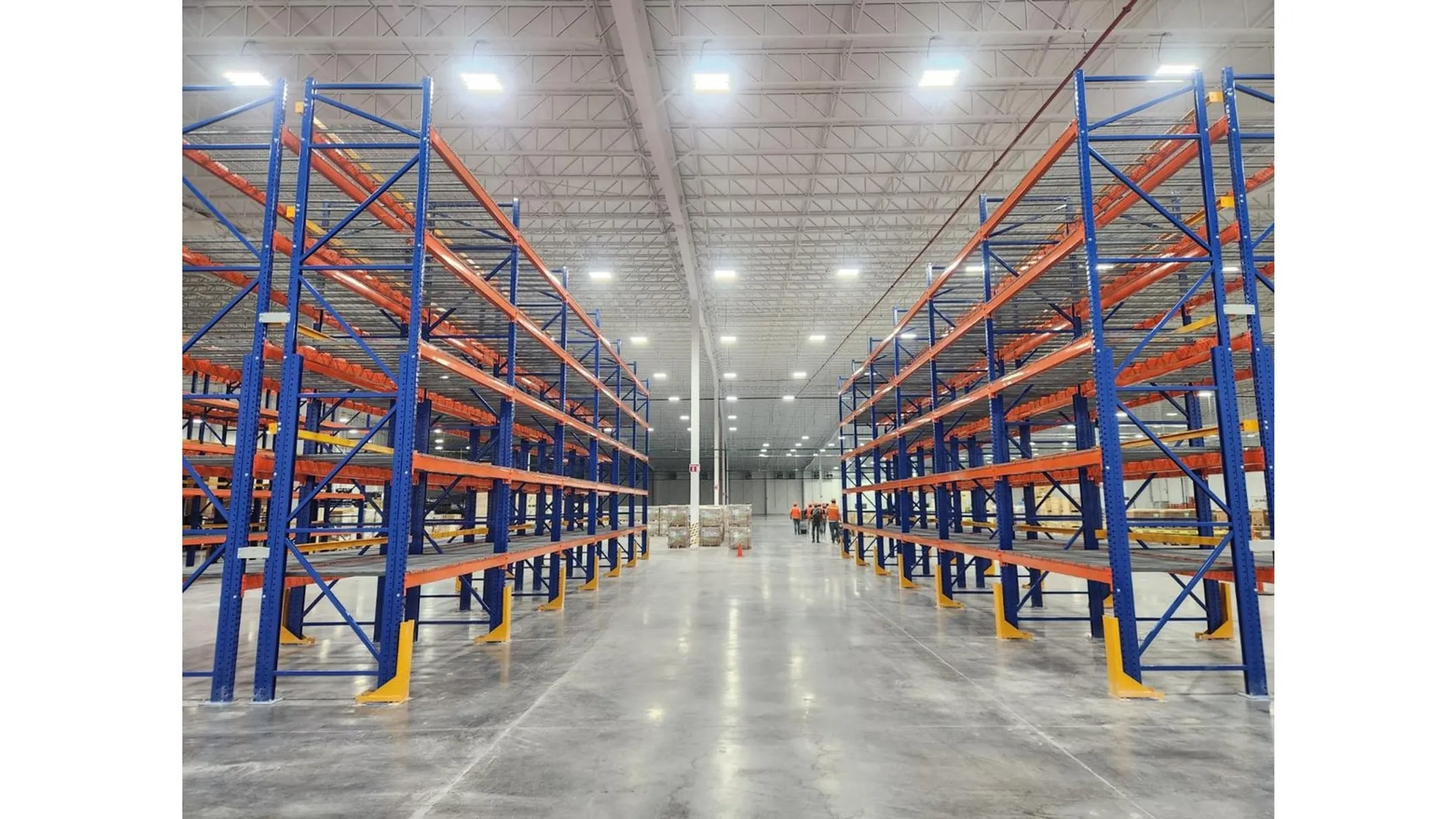Damaged warehouse pallet racking with bent frame and forklift impact