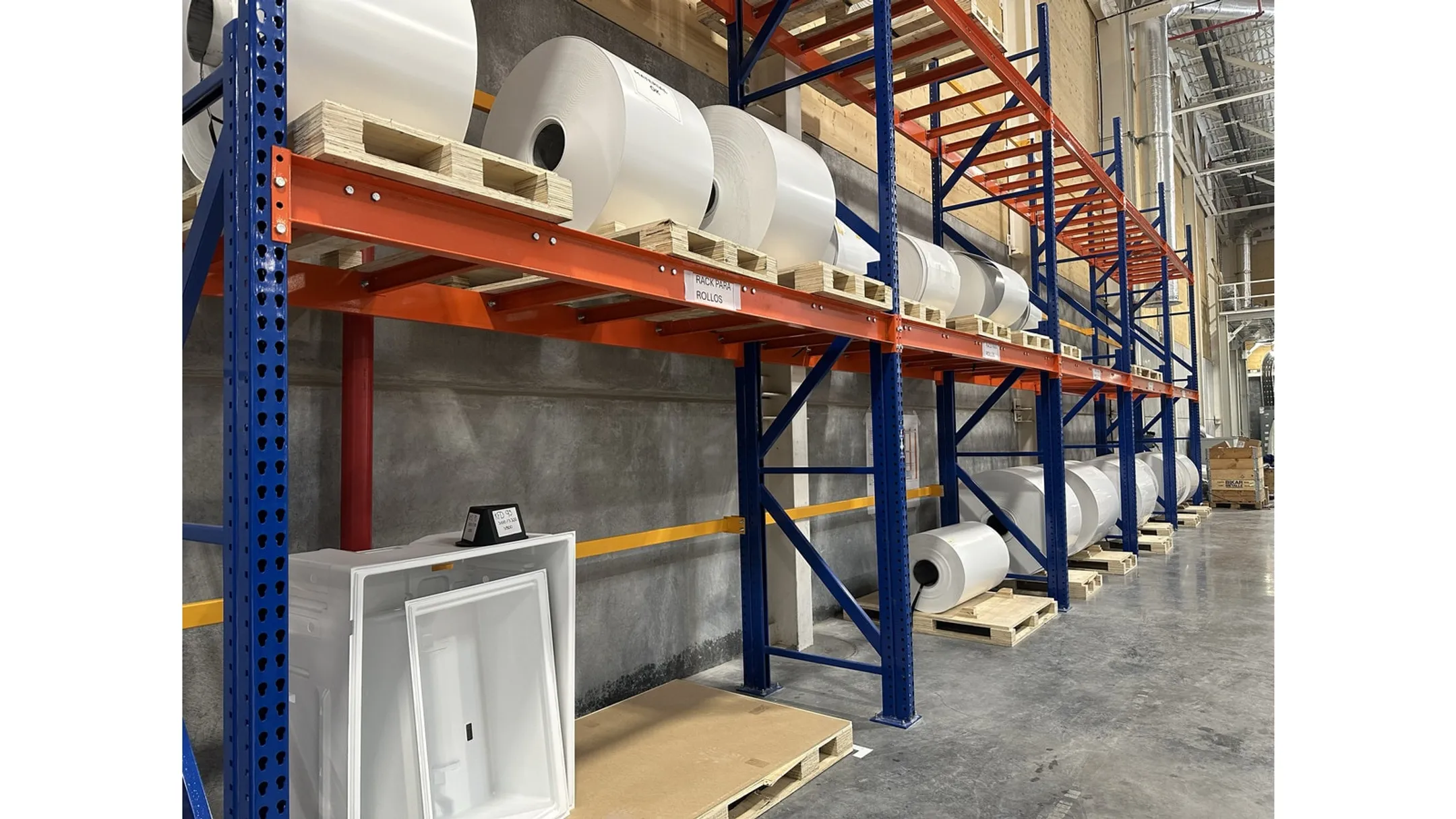 Heavy-duty structural steel pallet racking in industrial warehouse setting