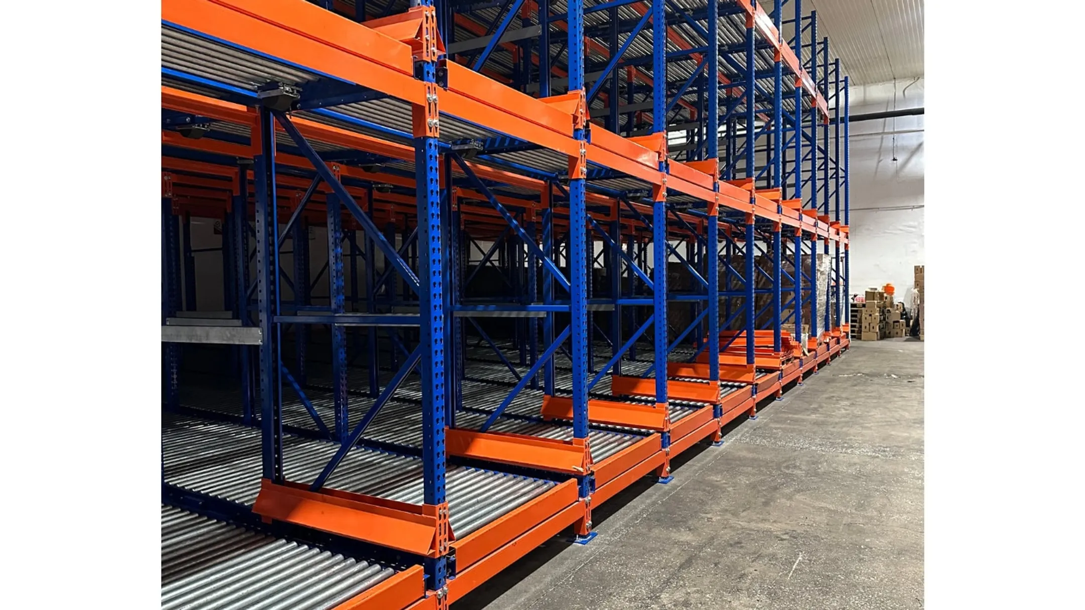 RackUSA Matador automated pallet shuttle system inside rack channel