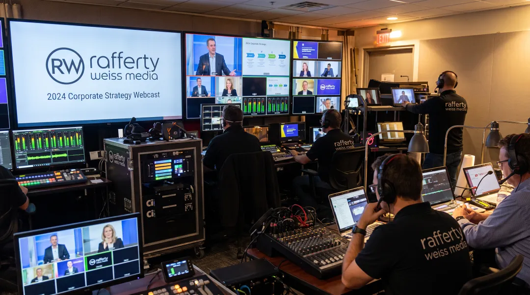 Production crew operating multi-camera webcast control room setup