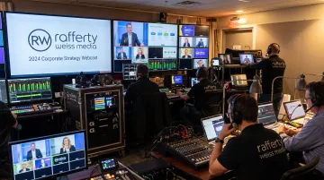 Production crew operating multi-camera webcast control room setup