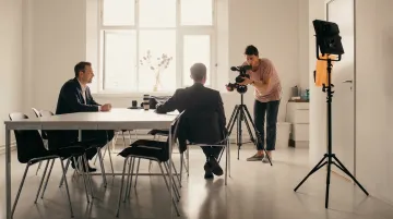 Unscripted employee interview on camera in modern office setting