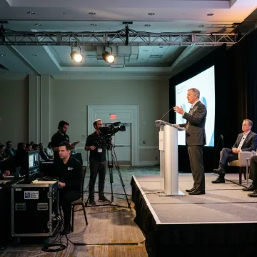 Corporate live event production crew managing a professional conference