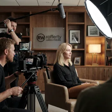 Corporate video crew filming an executive interview