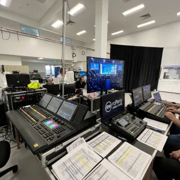 Production team coordinating a corporate event control setup