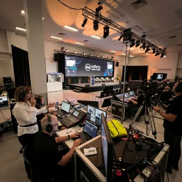 Producer coordinating an event video production crew